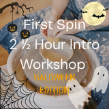 Promotional graphic for a Halloween-themed pottery workshop titled 'First Spin 2 1/2 Hour Intro Workshop HALLOWEEN EDITION'. The image shows a person's hands spinning clay on a pottery wheel, decorated with Halloween graphics including a spiderweb, jack-o'-lanterns, bats, ghosts, and a full moon.