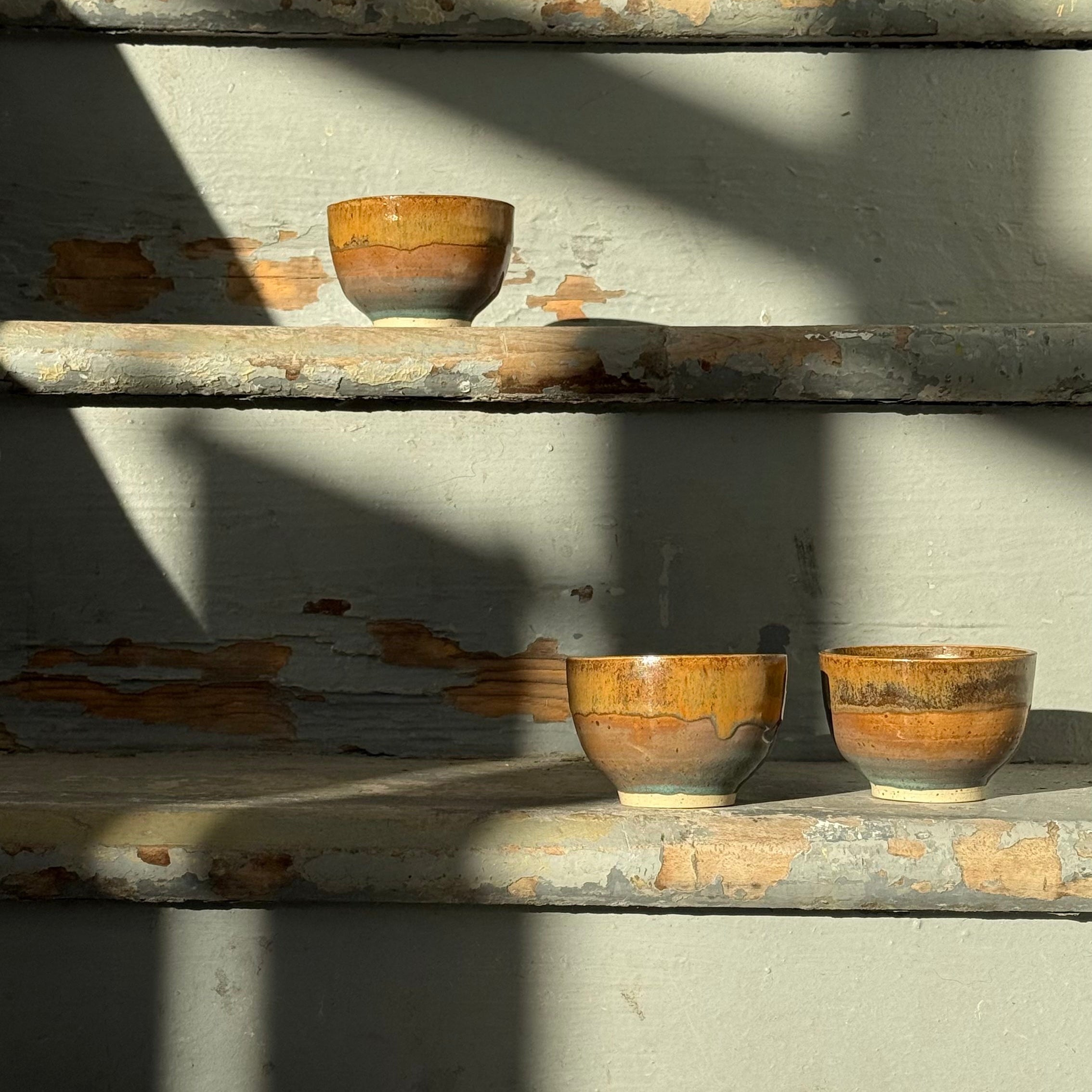 Beautiful ceramics on stairs with sunlight and shadows